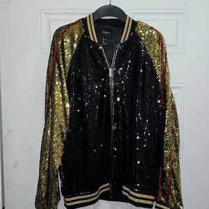 Sequin jacket that says “Sorry Not Sorry”